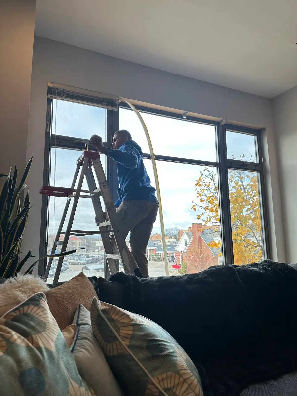 Handyman installing window treatments in Milwaukee